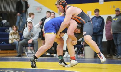 Grady Fey of Redfield, left, attempts to take down Lucas Rowland of Ipswich-Bowdle in their 285-pound match at the Region 1B tourney last Saturday in Volga. Both wrestlers will be competing in the State B tourney in Rapid City. Photo by Heather Bode