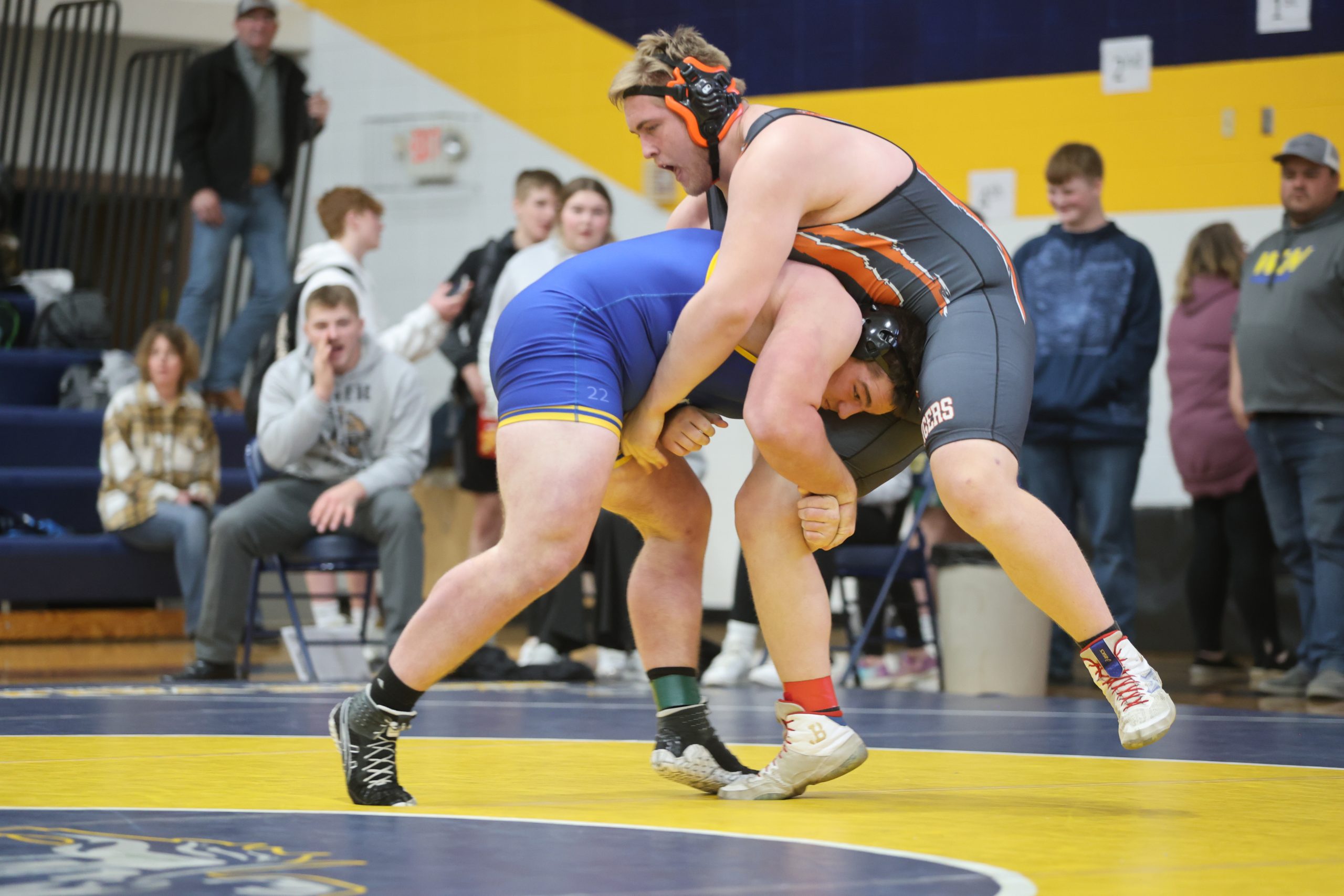 Grady Fey of Redfield, left, attempts to take down Lucas Rowland of Ipswich-Bowdle in their 285-pound match at the Region 1B tourney last Saturday in Volga. Both wrestlers will be competing in the State B tourney in Rapid City. Photo by Heather Bode